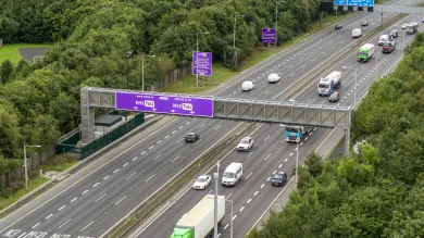 The image shows the M50 motorway in Dublin with vehicles driving over it.